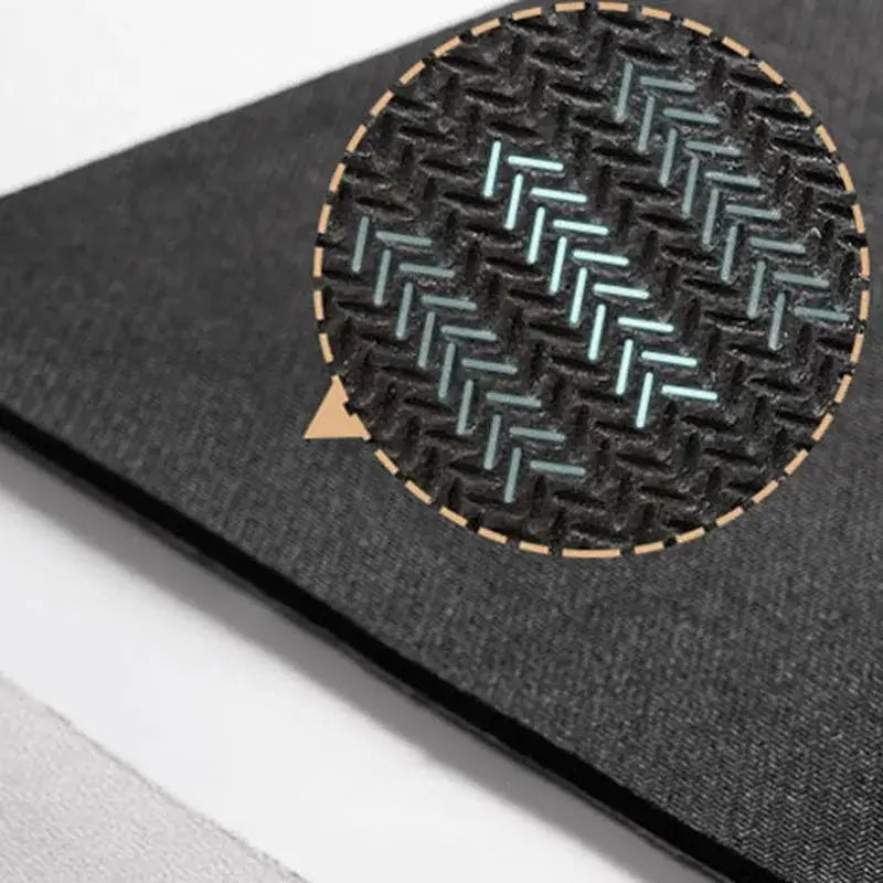 Black textured notebook cover with circular inset of light teal and gold geometric pattern for entry door mat design
