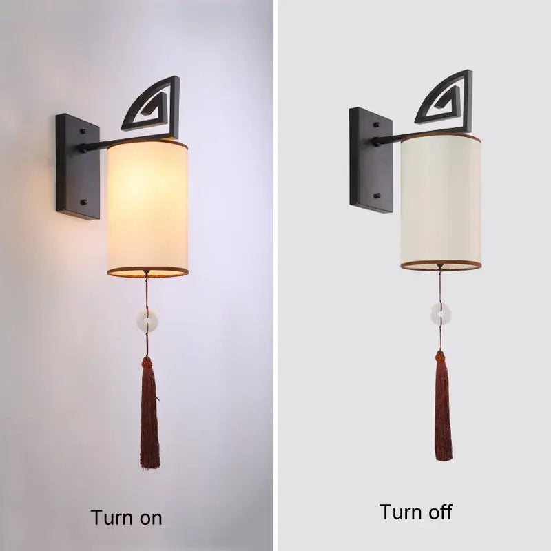 Black metal wall sconce with cylindrical off-white cloth shade and brown tassel decorbites e27 cloth wall sconce
