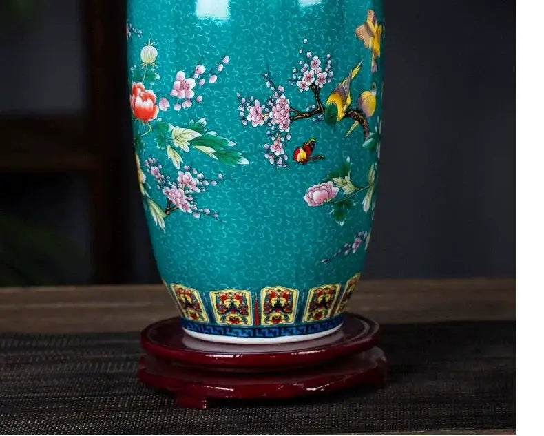 Teal porcelain DecorBites™ enamel colored vase decorated with hand-painted blossoms birds and insects on glossy surface