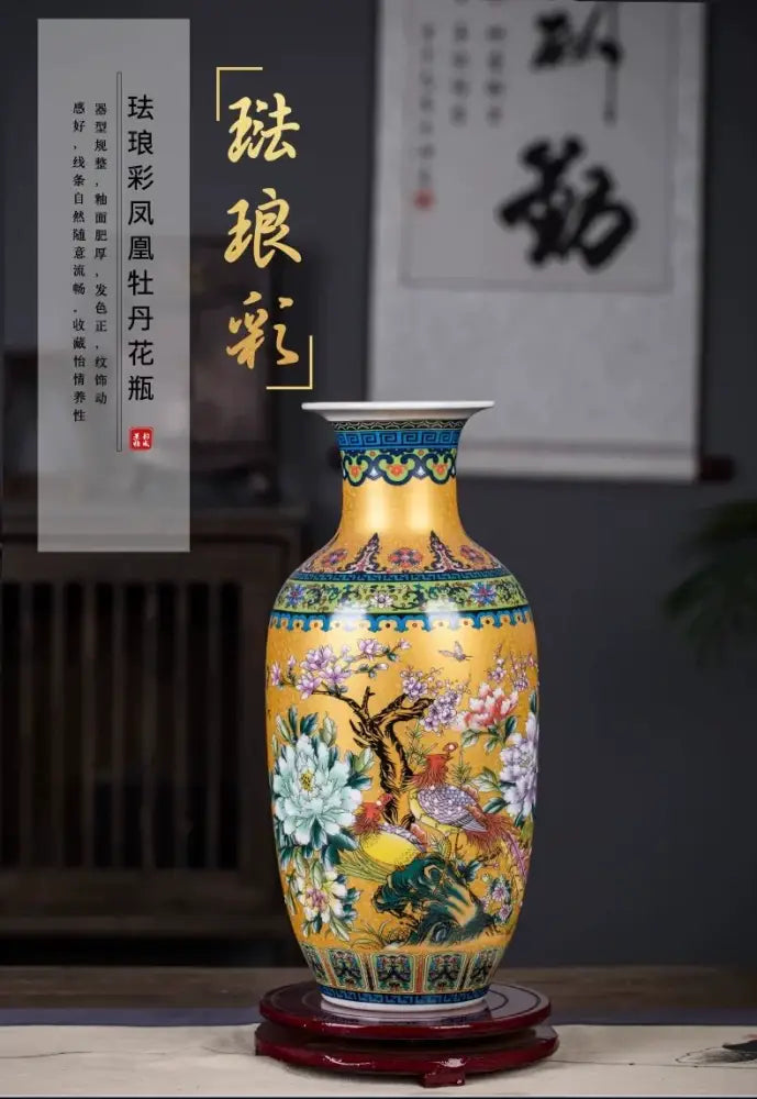 A vibrant yellow enamel colored vase by DecorBites™ with intricate hand-painted floral and bird motifs