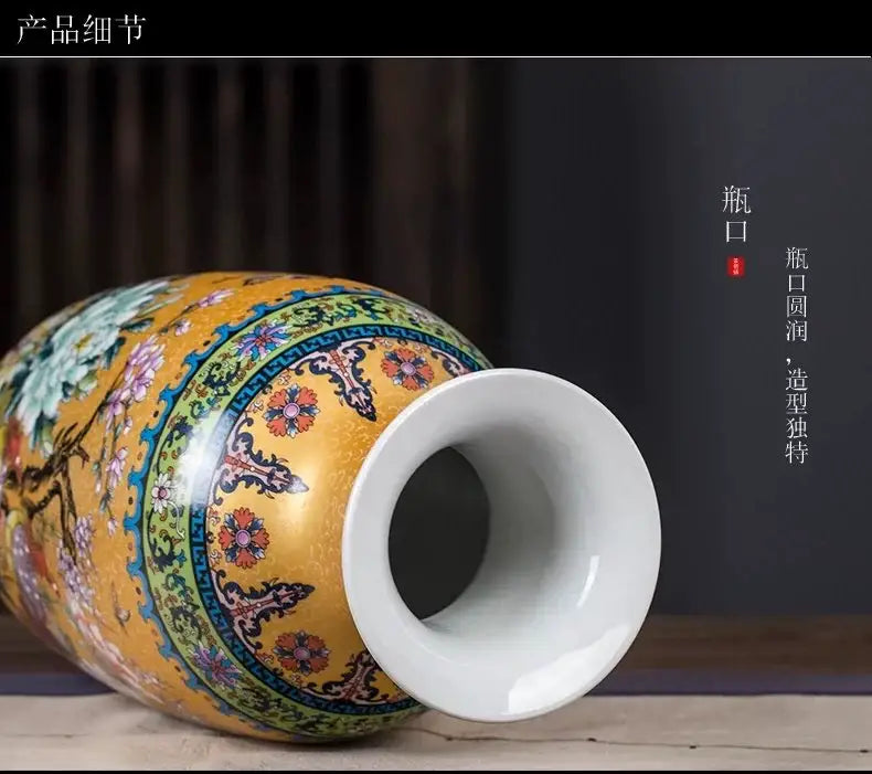 A vibrant yellow porcelain enamel colored vase with intricate floral and traditional Chinese motifs by DecorBites™