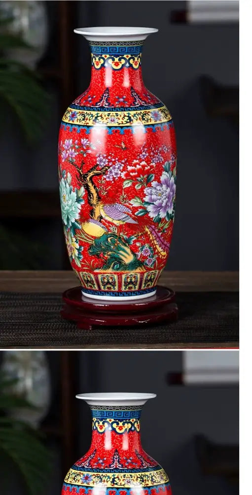 A vibrant red porcelain enamel colored vase by decorbites featuring hand-painted floral and bird motifs with gold trim