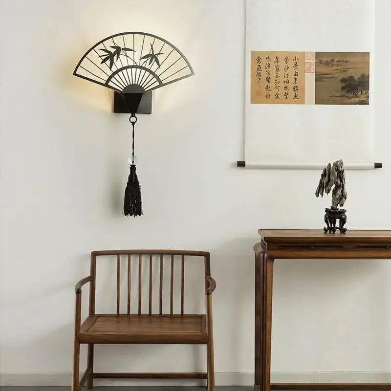 Black metal fan-shaped wall lamp with bamboo design and hanging tassel iron art wall lamp for living room lighting