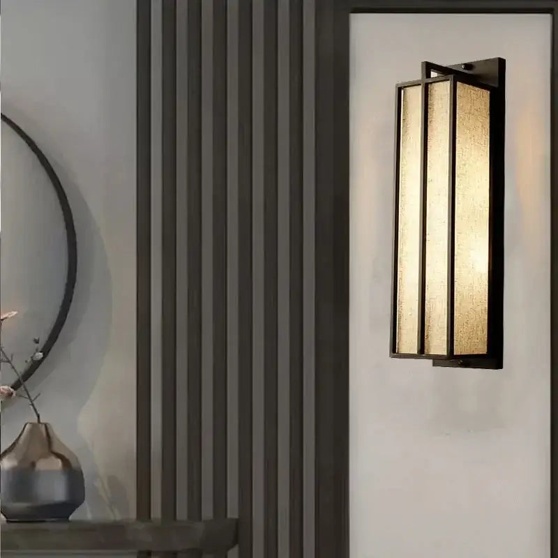 Modern decorbites chinese style wall lamp with black iron frame and three warm gold-toned linen cloth panels