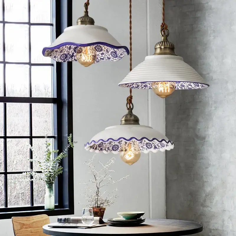 Three white ceramic hanging lamps with blue floral patterns and twisted copper cords by DecorBites chinese style porcelain
