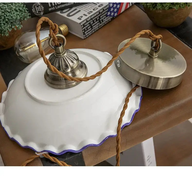 Decorbites chinese style hanging lamp features white scalloped porcelain plate with purple rim and braided cord suspension