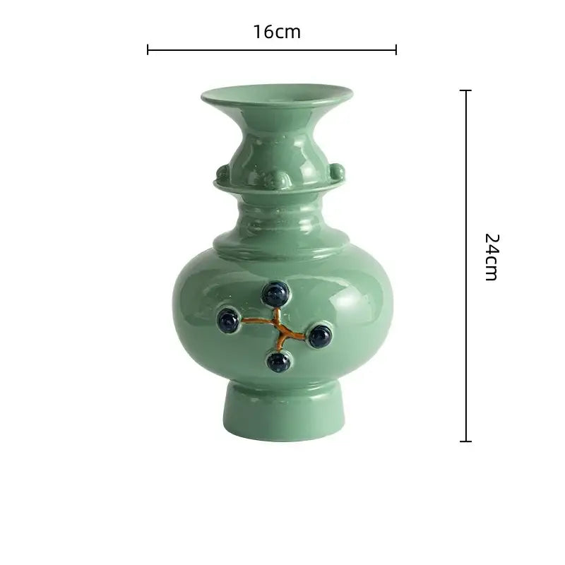 DecorBites™ retro ceramic vase in light green with dark blue accents and gold lines for elegant home decor