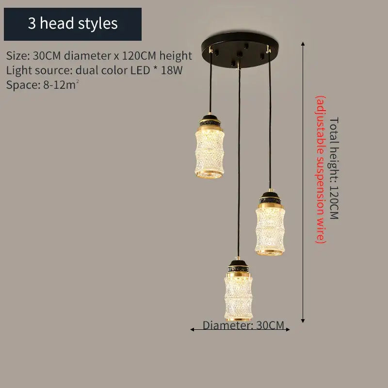 Three-head decorbites™ spiral staircase chandelier with clear textured glass shades and gold-toned metal accents