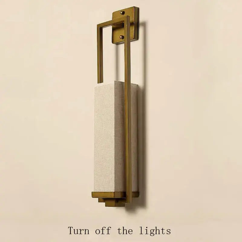 Modern brass-framed decorbites chinese style wall lamp with textured off-white fabric shade for bedroom and living room