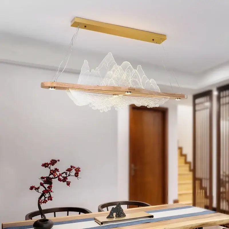 Modern minimalist decorbites™ wood art chandelier with gold ceiling mount and wooden base featuring illuminated mountain design