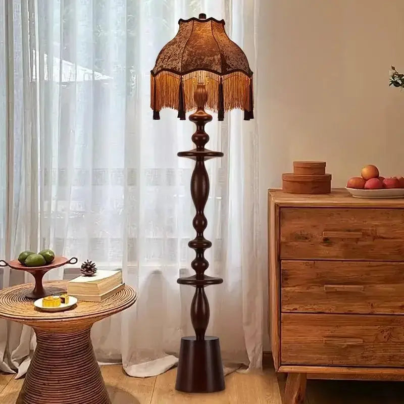 Antique style floor lamp with dark wood base and ornate brown lace shade from DecorBites Chinese Tassels floor lamp collection