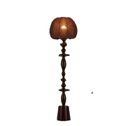 Dark brown wooden floor lamp with textured warm-toned fabric shade from decorbites chinese tassels floor collection