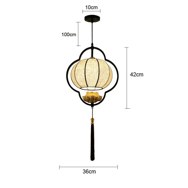 Black metal frame teahouse lantern chandelier with beige woven fabric shade and gold lotus flower detail for dining room
