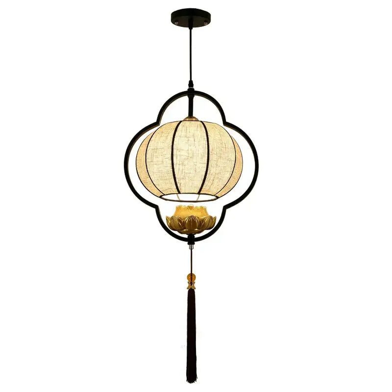 Black metal frame teahouse lantern chandelier with beige woven fabric shade and golden lotus motif for dining room use