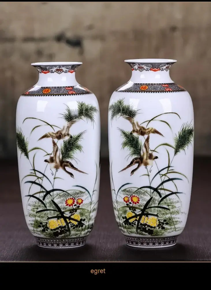 Pair of white porcelain chinese traditional ceramic vases with hand-painted bird and foliage scenes for home decor