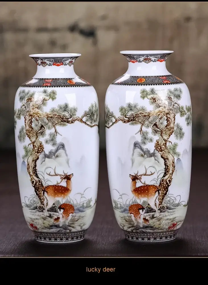 Pair of white porcelain chinese traditional ceramic vases with hand-painted deer scenes and decorative borders for home decor