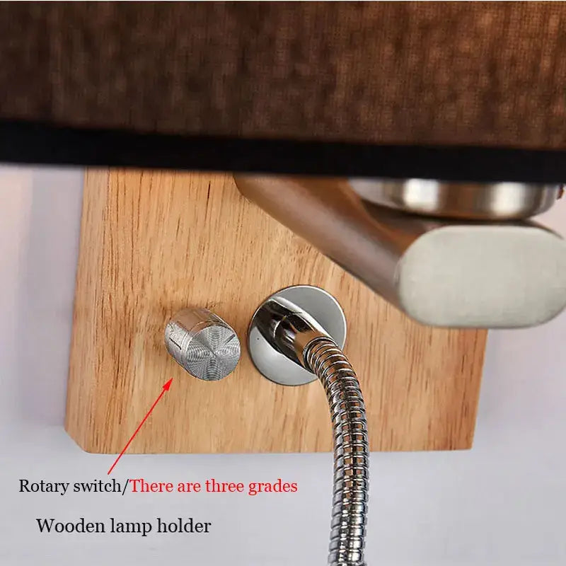 Silver rotary switch with starburst pattern on light wood holder of decorbites™ chinese wood led wall lamp