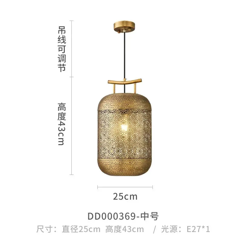 A brass cylindrical pendant light with intricate geometric cutouts and adjustable chain from decorbites zen art birdcage collection