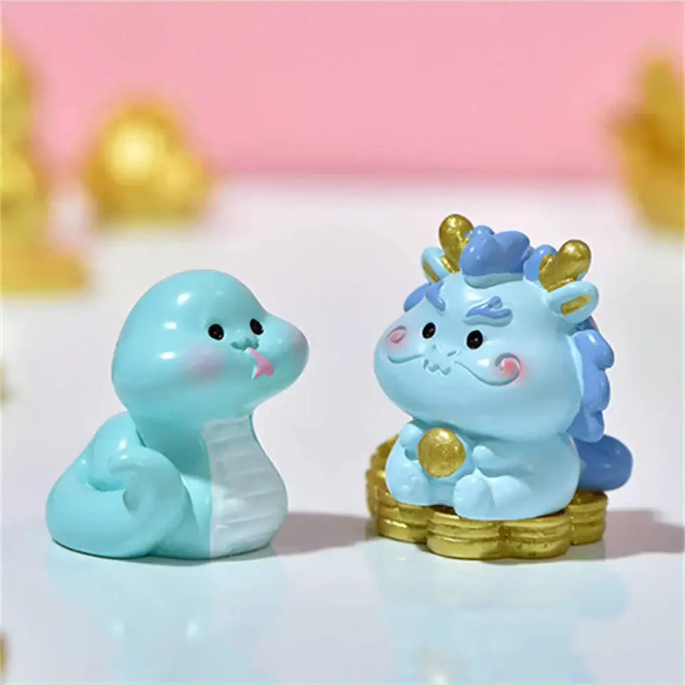 Cute light blue resin snake and dragon figurines with gold accents from decorbites amethyst tree figurines collection
