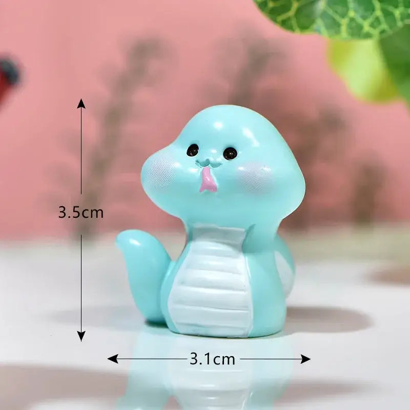 Cute light blue resin snake figurine with pink tongue and white belly stripes for DecorBites amethyst tree figurines