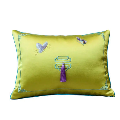 A vibrant yellow satin decorbites chinoiserie butterfly embroidered cushion cover with a purple tassel for mahogany sofa