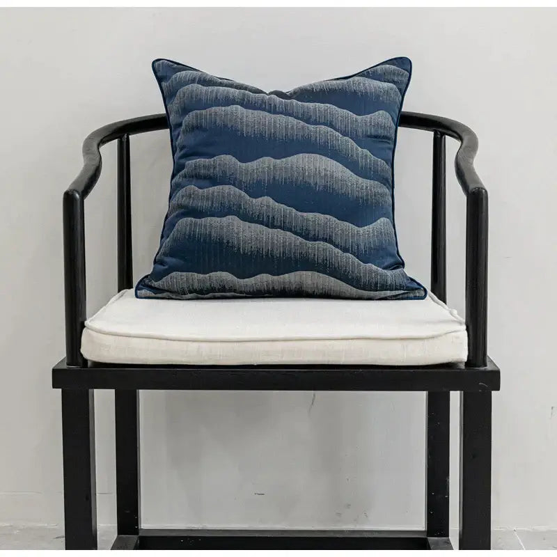Deep blue pillow cover with subtle gray wave patterns crafted from textured fabric by DecorBites chinoiserie decor throw