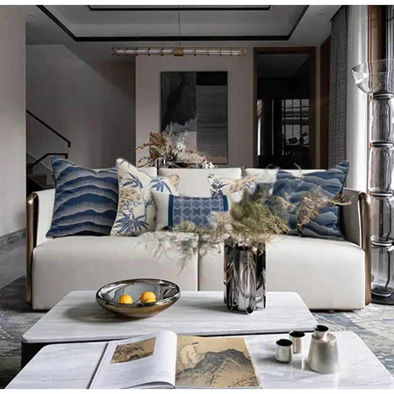 White sofa with gold-tone armrests and blue DecorBites™ chinoiserie decor throw pillow cover 45x45cm for living room