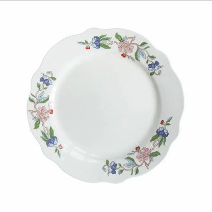 White ceramic decorbites chinoiserie floral birds dinner plate with scalloped edge and pink blue green floral pattern