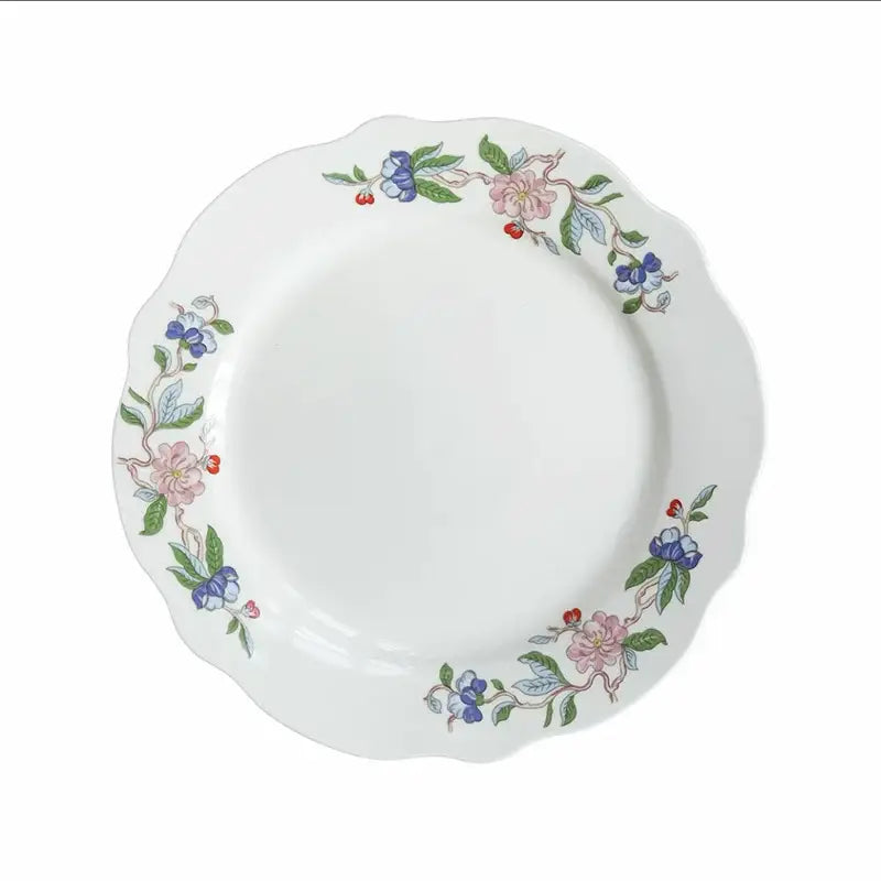 White ceramic decorbites chinoiserie floral birds dinner plate with scalloped edge and pink blue green floral pattern