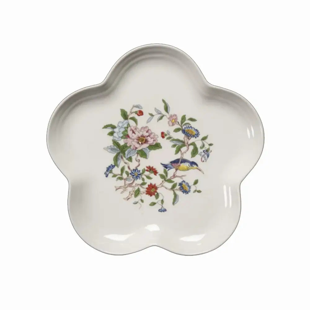 A delicate white ceramic decorbites chinoiserie floral birds dinner plate with hand-painted pink blue blossoms and green leaves
