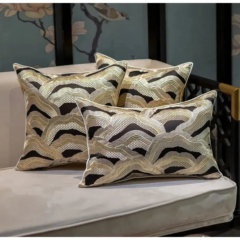 Three elegant rectangular throw pillows with decorbites chinoiserie golden embroidered cushion cover on light sofa
