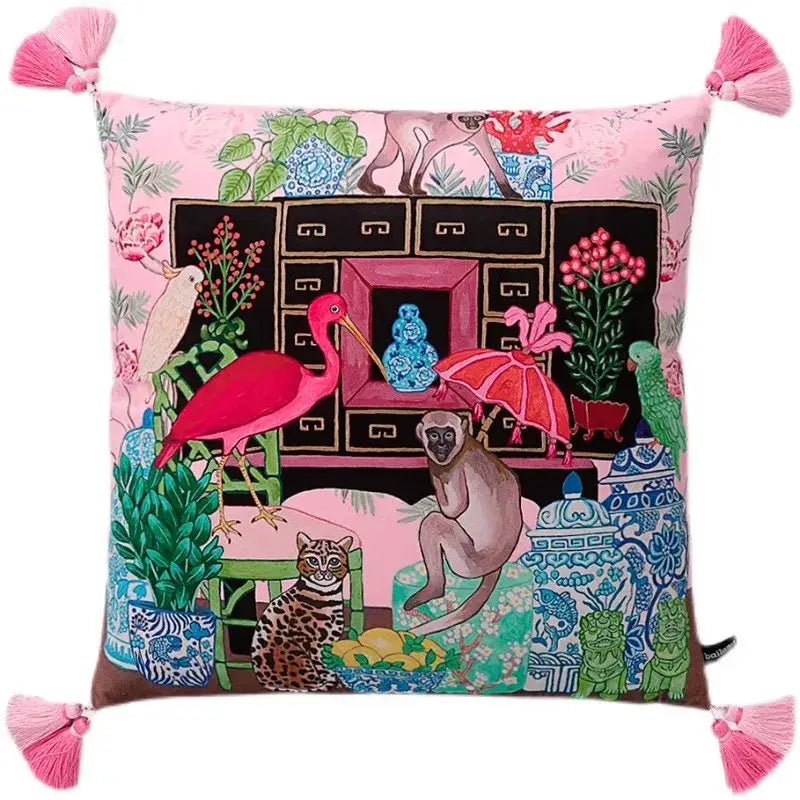 Pink cushion with decorbites chinoiserie monkey umbrella peonies design featuring animals and pink tassels at corners