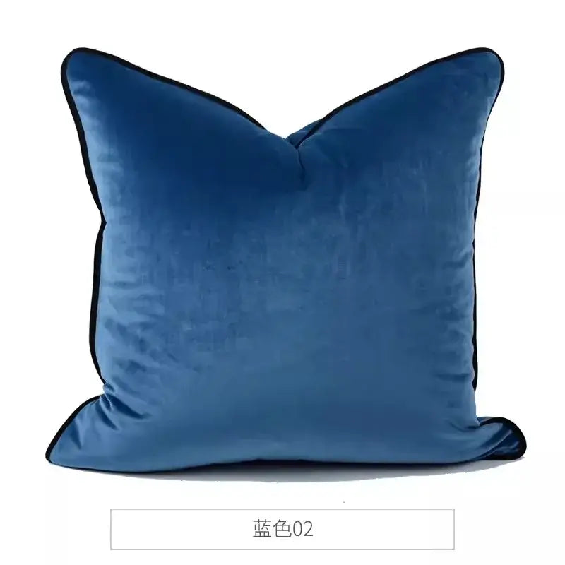 A plush navy blue velvet decorbites chinoiserie monkey umbrella peonies pillow with contrasting black trim edges