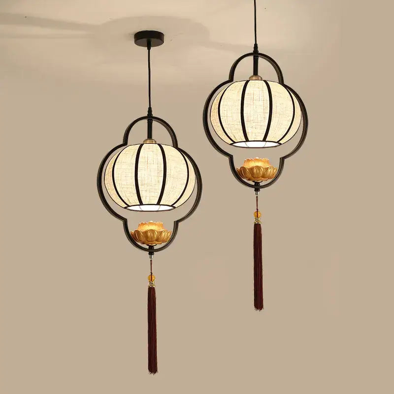 Black-framed decorbites chinoiserie retro chandelier with cream woven fabric shades and golden lotus accents for dining room