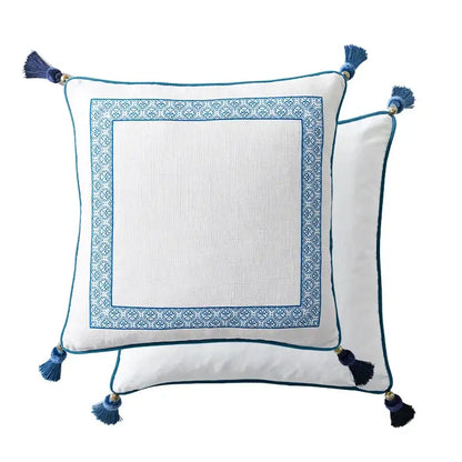 White lumbar pillow case with blue embroidered border and tassels from decorbites chinoiserie collection