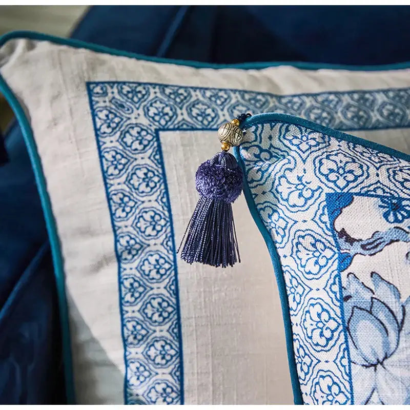 DecorBites™ chinoiserie style lumbar pillow case with blue and white porcelain birds pattern teal border and purple tassel accent