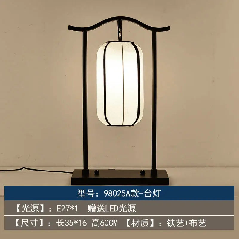 Black iron frame floor lamp with cylindrical white fabric shade by decorbites chinoiserie table floor collection