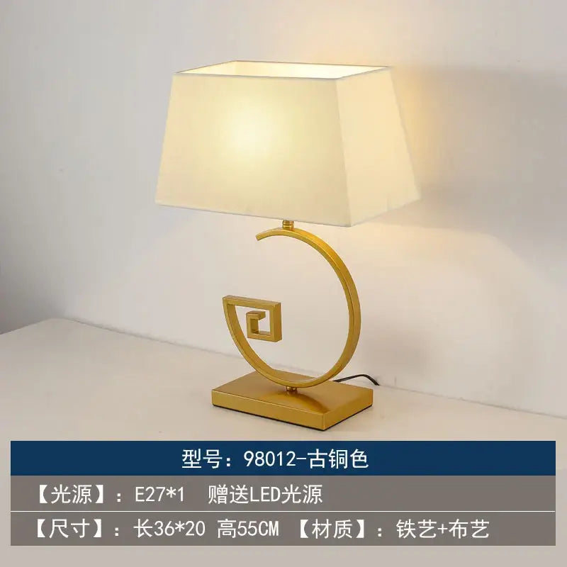 Gold-finished decorbites chinoiserie table floor lamp with cream fabric shade and ornate spiral base for elegant lighting