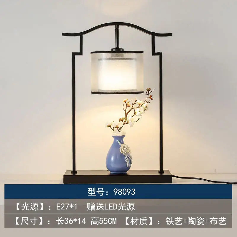 Black iron frame decorbites chinoiserie table floor lamp with translucent cylindrical shade and blue ceramic vase