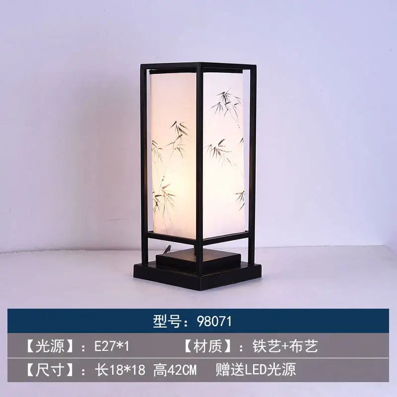 Black-framed DecorBites Chinoiserie table floor lamp with translucent white panels and black bamboo brushstroke design