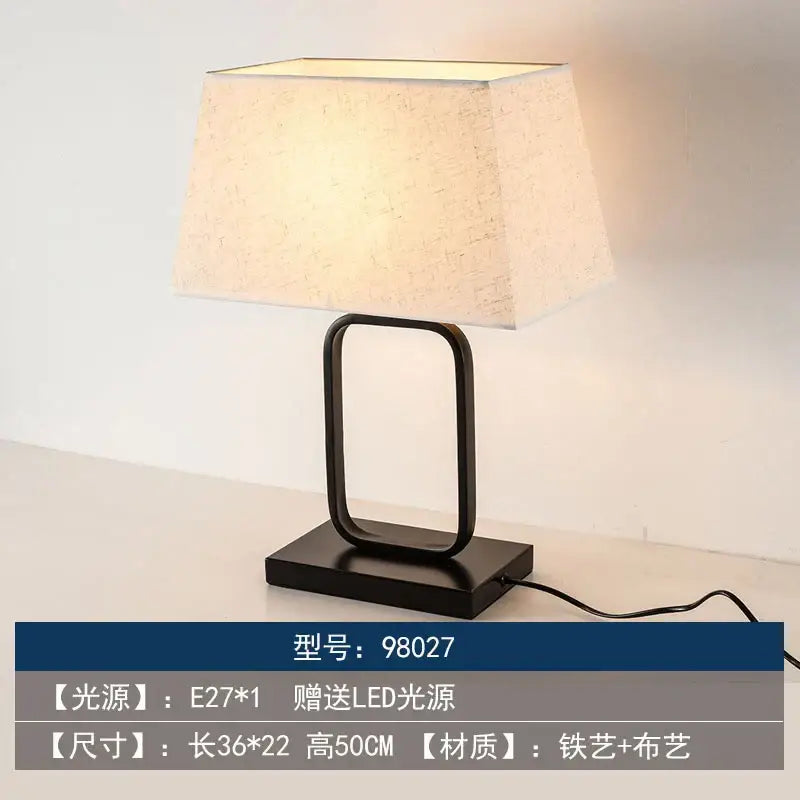 Black metal floor lamp with rectangular textured off-white fabric shade in decorbites chinoiserie table floor design