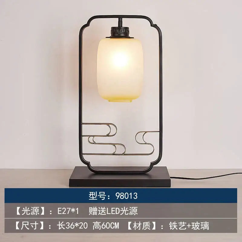 Black iron and glass DecorBites chinoiserie table floor lamp with warm frosted glass shade for elegant living spaces