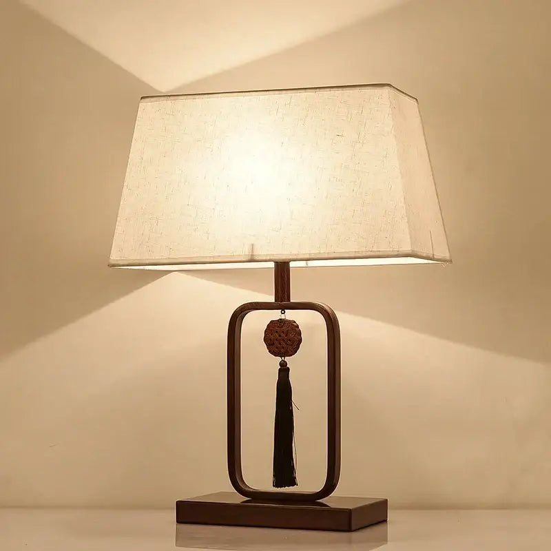 Decorbites chinoiserie table floor lamp with warm off-white fabric shade and dark bronze frame for elegant living rooms