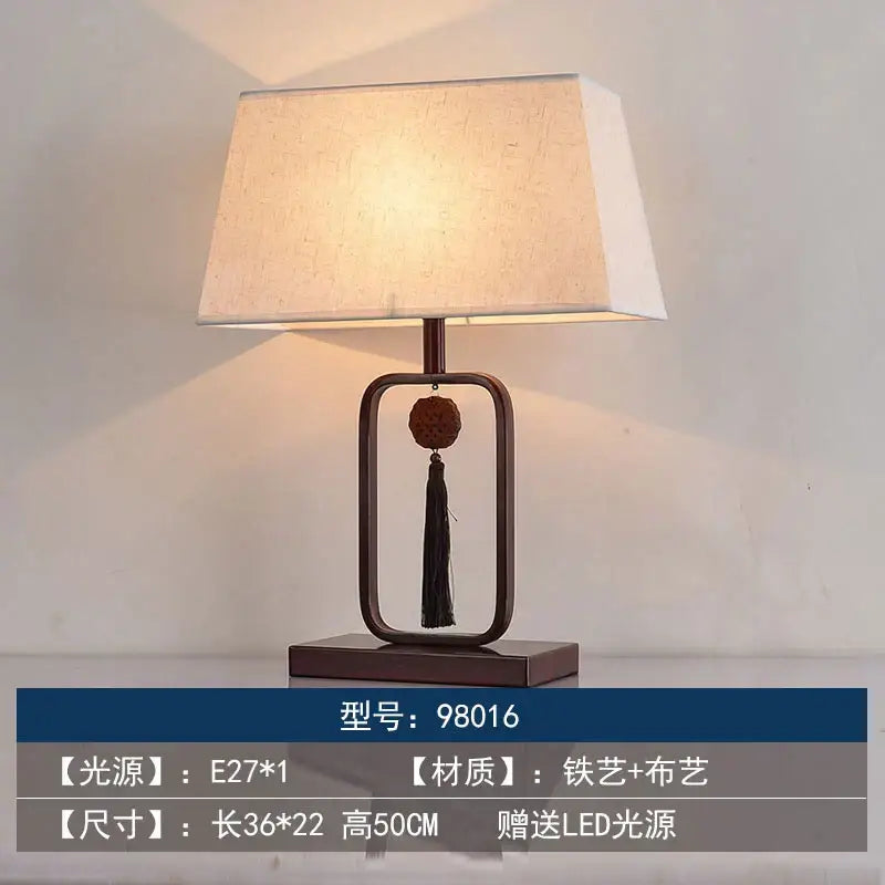 Modern decorbites chinoiserie table floor lamp with beige linen shade and dark bronze frame featuring wooden bead pendant