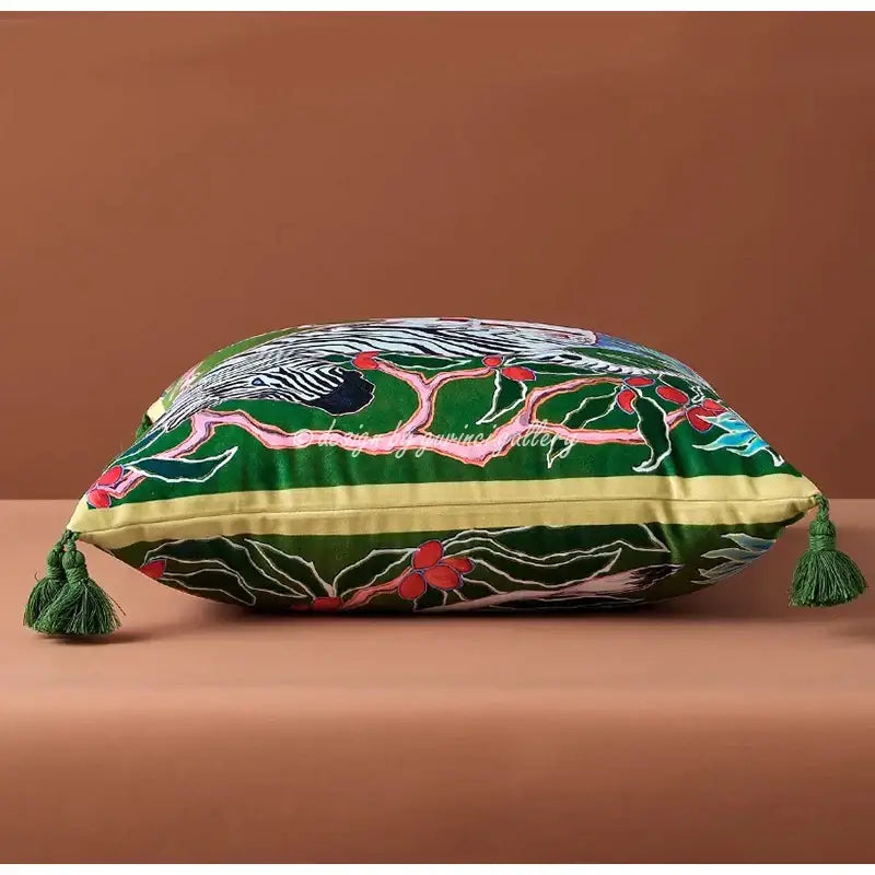 Green velvet cushion cover with intricate bird embroidery and tassels from decorbites chinoiserie zebra peonies cushion cover collection