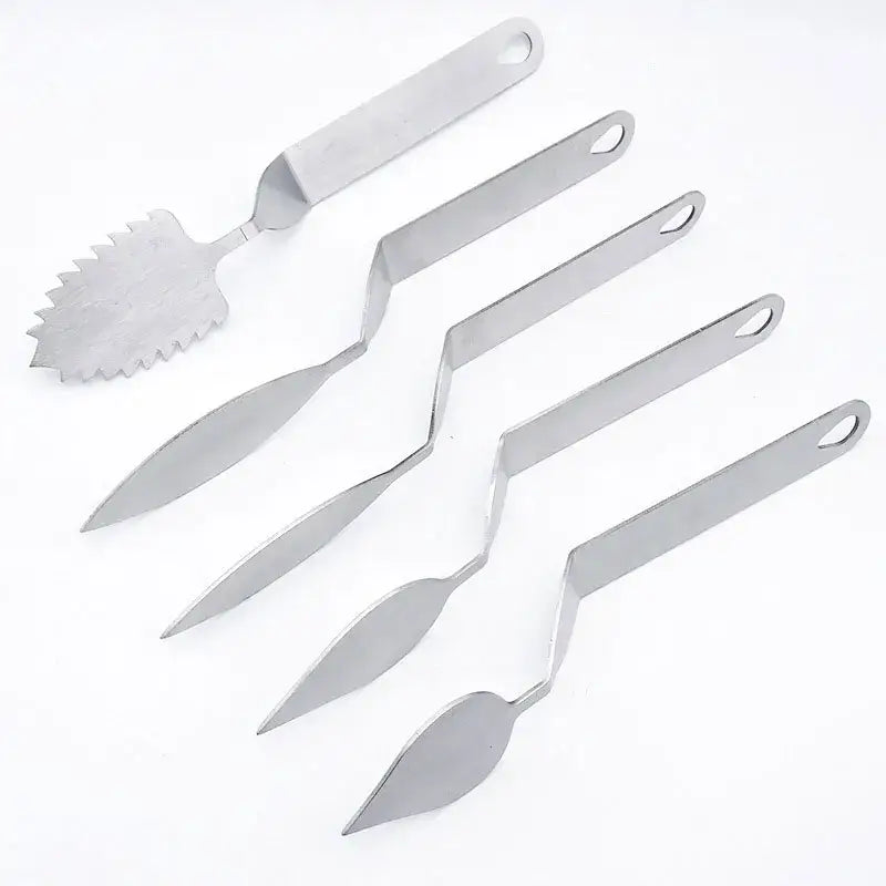 Set of six stainless steel decorbites chocolate leaf knives with varied blade shapes including serrated leaf knife fondant tool