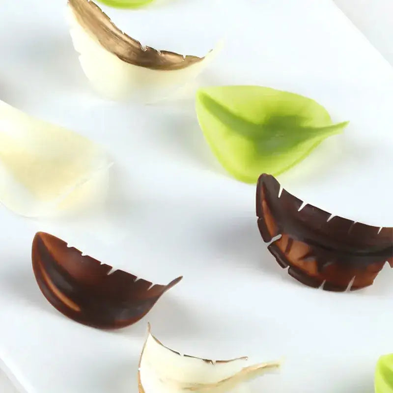 Translucent leaf-shaped silicone food molds in green white and brown for decorbites chocolate leaf knife fondant use