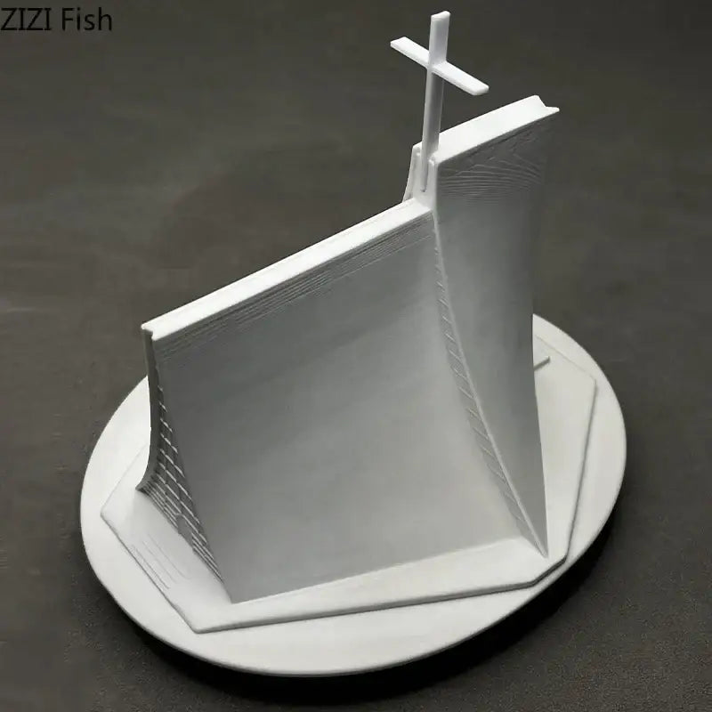 White 3d-printed DecorBites Christian Church gypsum ornament featuring modern angular architecture with a cross on top