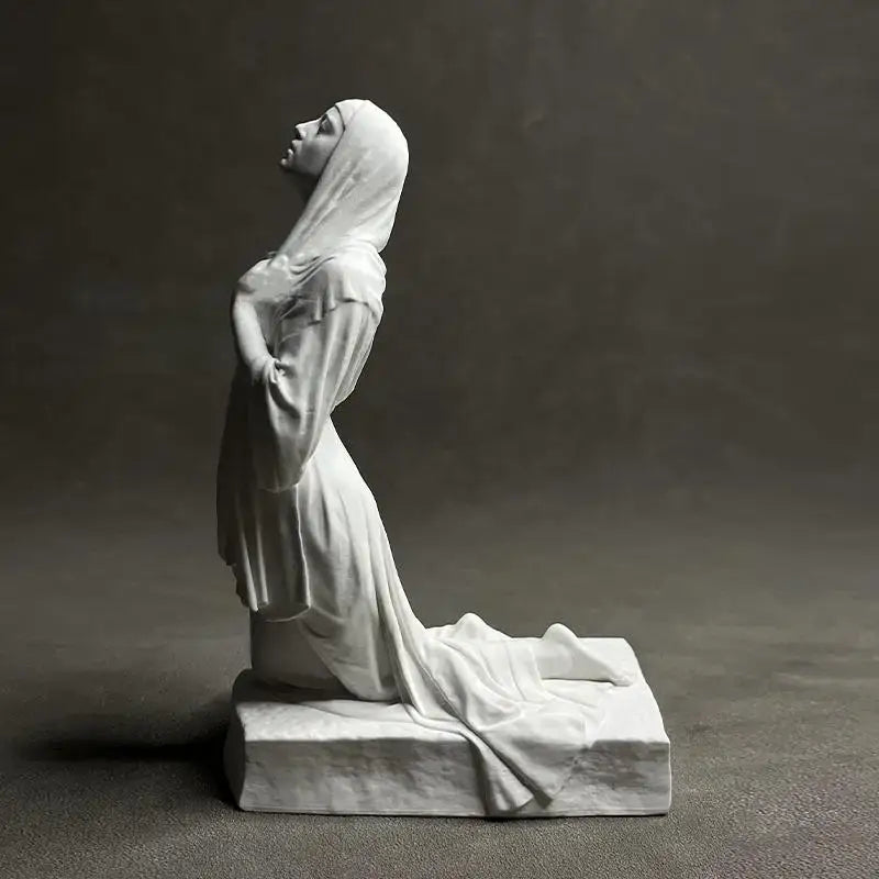 White marble christian pray sculpture of a woman kneeling in flowing robes on a rectangular base by decorbites resin figurine