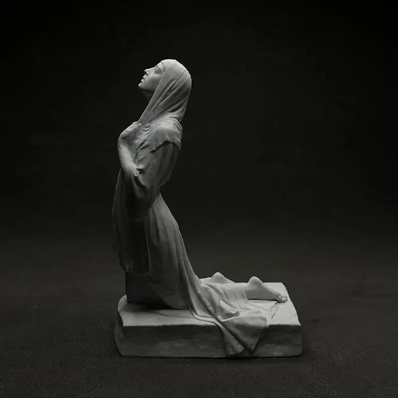 White marble christian pray sculpture of a kneeling figure in flowing robes made from resin for home decor